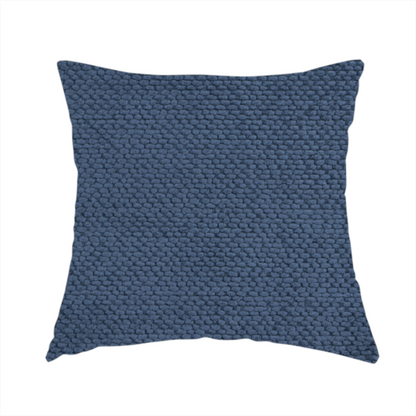 The fabric used to create this handmade cushion is a deep, rich navy blue upholstery fabric. It features the signature dense, uniform, boucle-style weave of the collection, composed of small, looped, and nubby yarn fibres that create a soft and tactile surface.