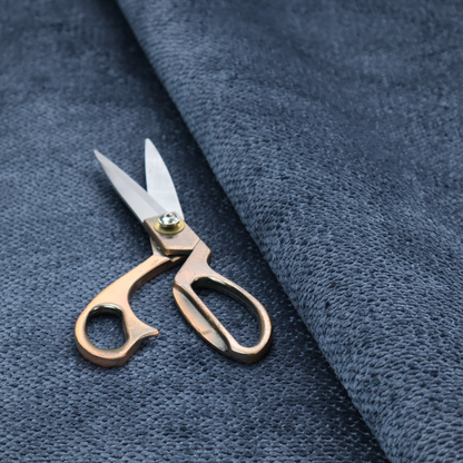 A deep, rich navy blue upholstery fabric. It features the signature dense, uniform, boucle-style weave of the collection, composed of small, looped, and nubby yarn fibres that create a soft and tactile surface.