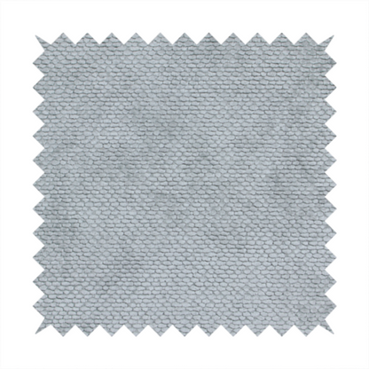 A soft, light-toned, cool-grey upholstery fabric. It features the signature dense, uniform, boucle-style weave of the collection, created with small, looped, and nubby yarn fibres that offer a comfortable, tactile surface.
