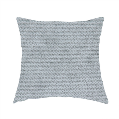The fabric used to create this handmade cushion is a soft, light-toned, cool-grey upholstery fabric. It features the signature dense, uniform, boucle-style weave of the collection, created with small, looped, and nubby yarn fibres that offer a comfortable, tactile surface.