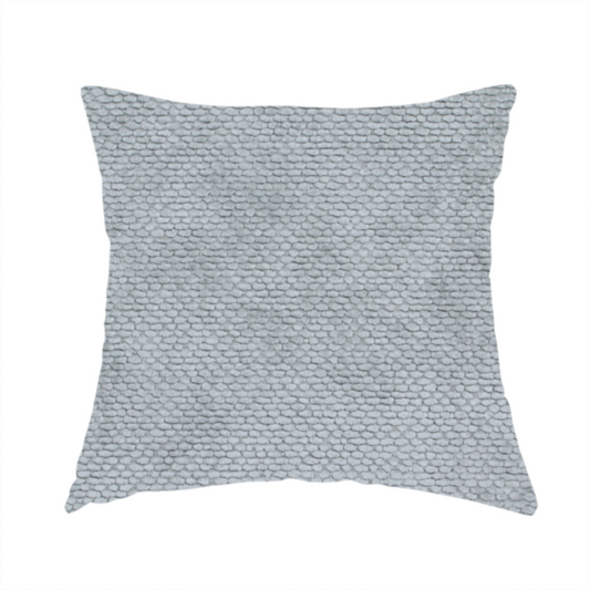 The fabric used to create this handmade cushion is a soft, light-toned, cool-grey upholstery fabric. It features the signature dense, uniform, boucle-style weave of the collection, created with small, looped, and nubby yarn fibres that offer a comfortable, tactile surface.