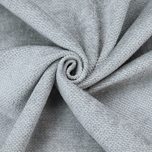 A soft, light-toned, cool-grey upholstery fabric. It features the signature dense, uniform, boucle-style weave of the collection, created with small, looped, and nubby yarn fibres that offer a comfortable, tactile surface.