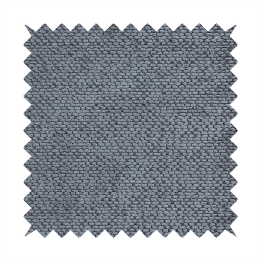 A deep, moody charcoal or slate-grey upholstery fabric. It maintains the signature dense, uniform, boucle-style weave of the collection, composed of small, looped, and nubby yarn fibres that provide a soft and tactile surface.