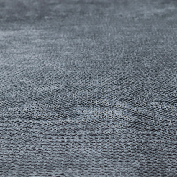 A deep, moody charcoal or slate-grey upholstery fabric. It maintains the signature dense, uniform, boucle-style weave of the collection, composed of small, looped, and nubby yarn fibres that provide a soft and tactile surface.