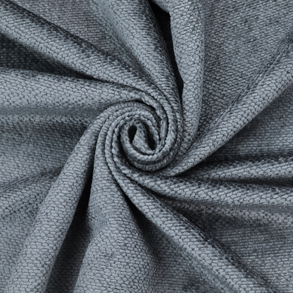A deep, moody charcoal or slate-grey upholstery fabric. It maintains the signature dense, uniform, boucle-style weave of the collection, composed of small, looped, and nubby yarn fibres that provide a soft and tactile surface.