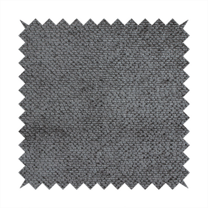 A deep, dark grey or graphite-toned upholstery fabric. It features the signature dense, uniform, boucle-style weave of the collection, composed of small, looped, and nubby yarn fibres that create a soft and tactile surface.