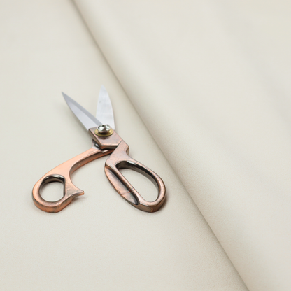 A solid pearl-coloured fabric texture with a fine, smooth weave.