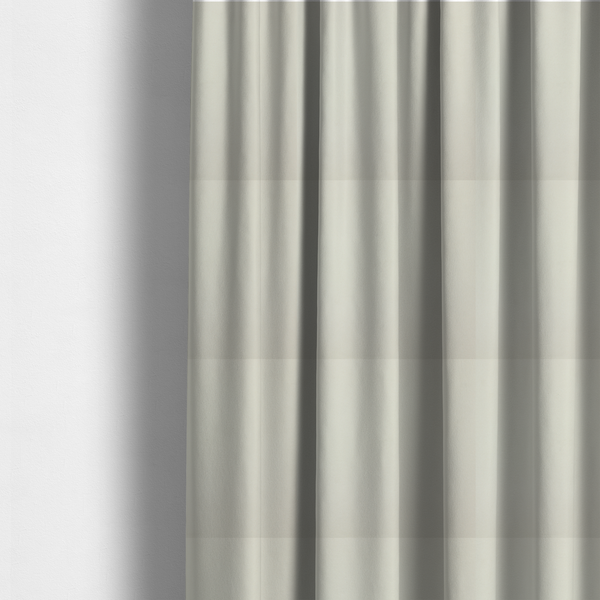 the fabric used to create these made-to-measure curtains is a solid pearl-coloured fabric texture with a fine, smooth weave.