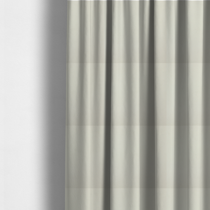 the fabric used to create these made-to-measure curtains is a solid pearl-coloured fabric texture with a fine, smooth weave.