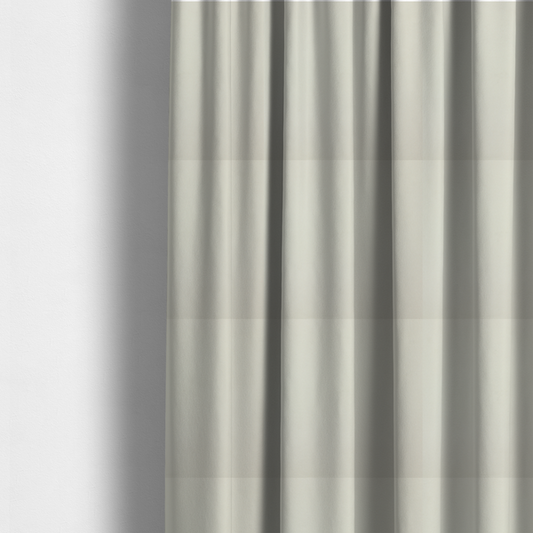 the fabric used to create these made-to-measure curtains is a solid pearl-coloured fabric texture with a fine, smooth weave.
