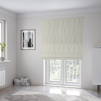 The fabric used to create these Roman blinds is a solid pearl-coloured fabric texture with a fine, smooth weave.