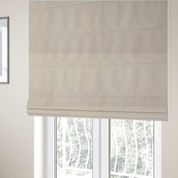 The fabric used to create these Roman blinds is a solid champagne-coloured Hallstatt faux leather fabric texture with a smooth, fine finish.