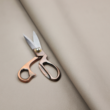 A solid taupe-coloured Hallstatt faux leather fabric texture with a smooth, fine finish.