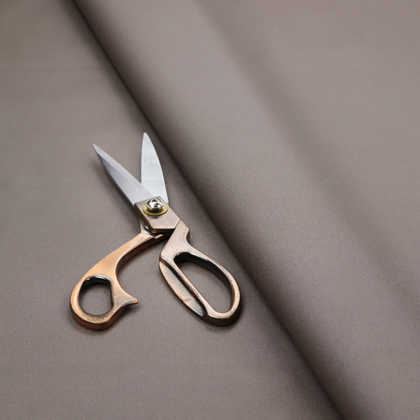 A solid brown-coloured Hallstatt faux leather fabric texture with a smooth, fine finish.