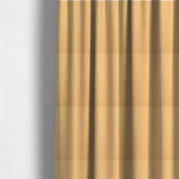 The fabric used to create these made-to-measure curtains is a solid yellow-coloured Hallstatt faux leather fabric texture with a smooth, fine finish.