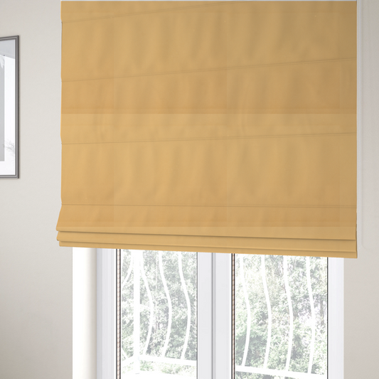 The fabric used to create these Roman blinds is a solid yellow-coloured Hallstatt faux leather fabric texture with a smooth, fine finish.
