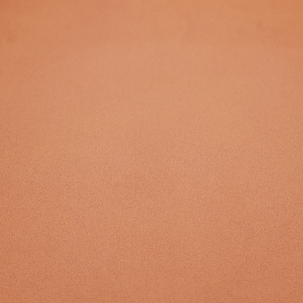 A solid orange-coloured Hallstatt faux leather fabric texture with a smooth, fine finish.