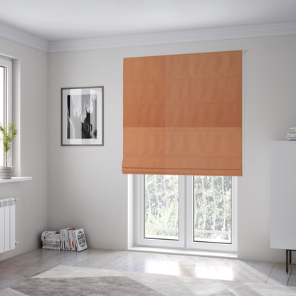 The fabric used to create these Roman blinds is a solid orange-coloured Hallstatt faux leather fabric texture with a smooth, fine finish.