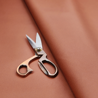 A solid rust-coloured Hallstatt faux leather fabric texture with a smooth, fine finish.
