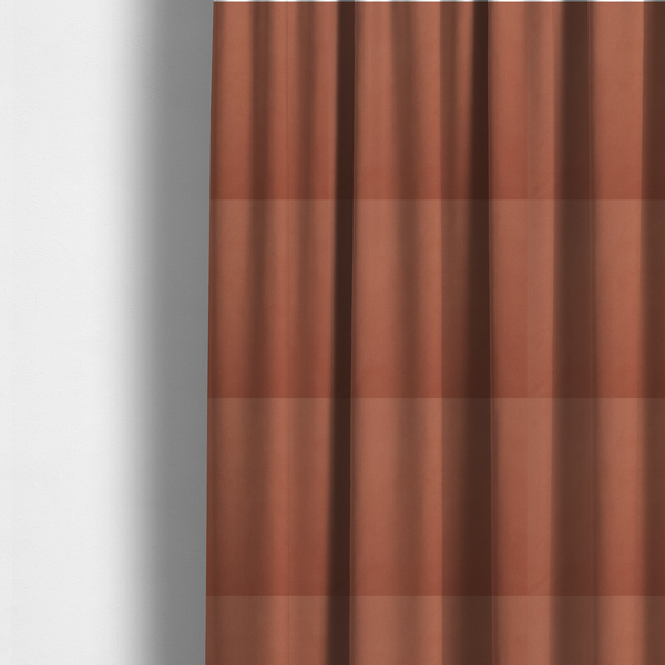 The fabric used to create these made-to-measure curtains is a solid rust-coloured Hallstatt faux leather fabric texture with a smooth, fine finish.
