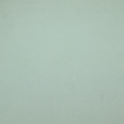 A solid sage green-coloured Hallstatt faux leather fabric texture with a smooth, fine finish.