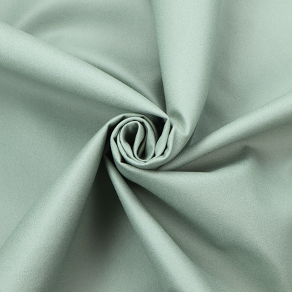 A solid sage green-coloured Hallstatt faux leather fabric texture with a smooth, fine finish.