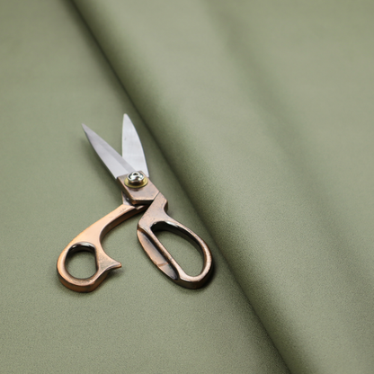 Plain, solid olive green-coloured Hallstatt faux leather fabric texture with a smooth, fine finish.