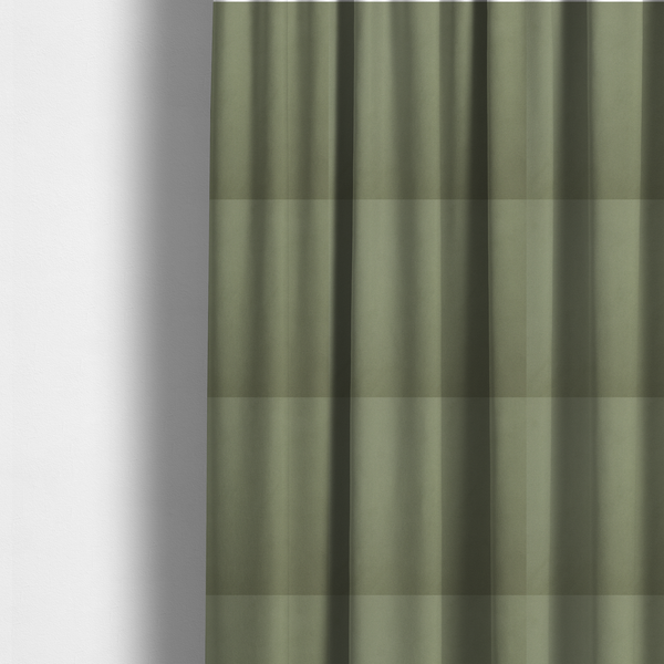 The fabric used to create these made-to-measure curtains is a plain, solid olive green-coloured Hallstatt faux leather fabric texture with a smooth, fine finish.
