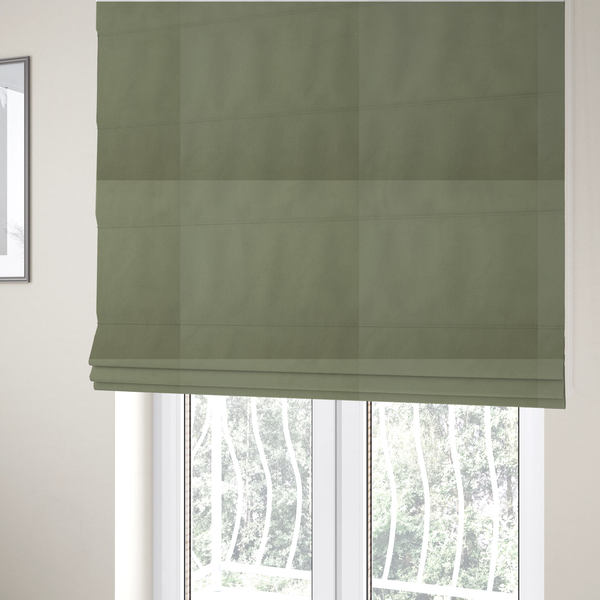 The fabric used to create these Roman blinds is a plain, solid olive green-coloured Hallstatt faux leather fabric texture with a smooth, fine finish.