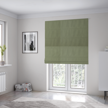 The fabric used to create these Roman blinds is a plain, solid olive green-coloured Hallstatt faux leather fabric texture with a smooth, fine finish.