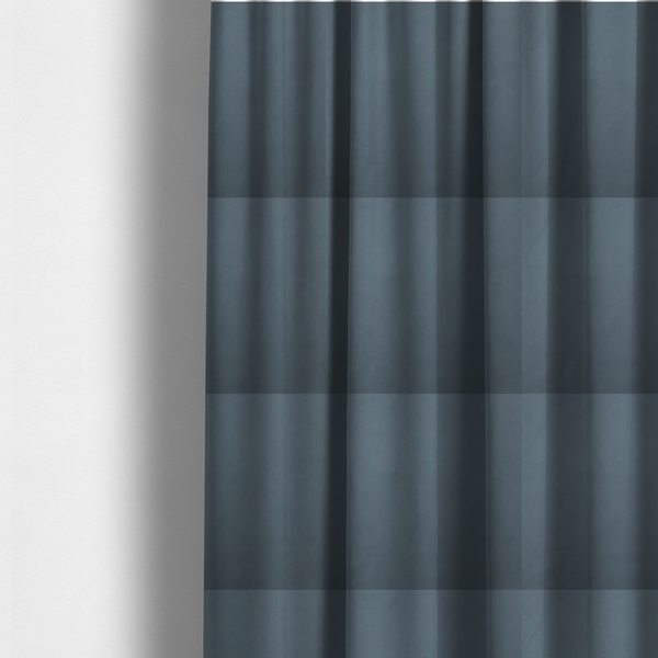 The fabric used to create these made-to-measure curtains is a plain, solid dark blue-coloured Hallstatt faux leather fabric texture with a smooth, fine finish.