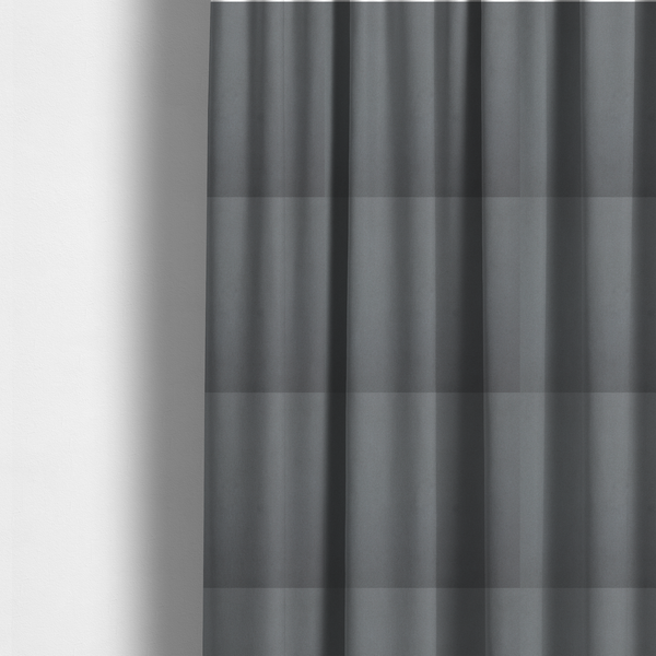 The fabric used to create these made-to-measure curtains is a plain, solid dark grey-coloured Hallstatt faux leather fabric texture with a smooth, fine finish.