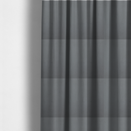 The fabric used to create these made-to-measure curtains is a plain, solid dark grey-coloured Hallstatt faux leather fabric texture with a smooth, fine finish.