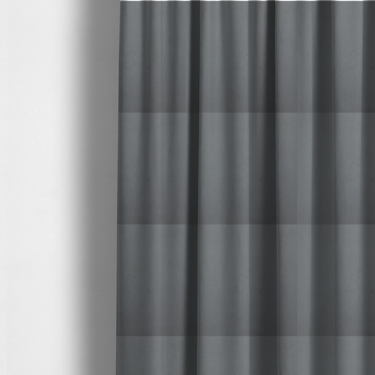 The fabric used to create these made-to-measure curtains is a plain, solid dark grey-coloured Hallstatt faux leather fabric texture with a smooth, fine finish.