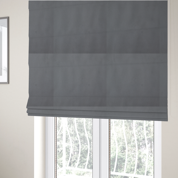 The fabric used to create these Roman blinds is a plain, solid dark grey-coloured Hallstatt faux leather fabric texture with a smooth, fine finish.