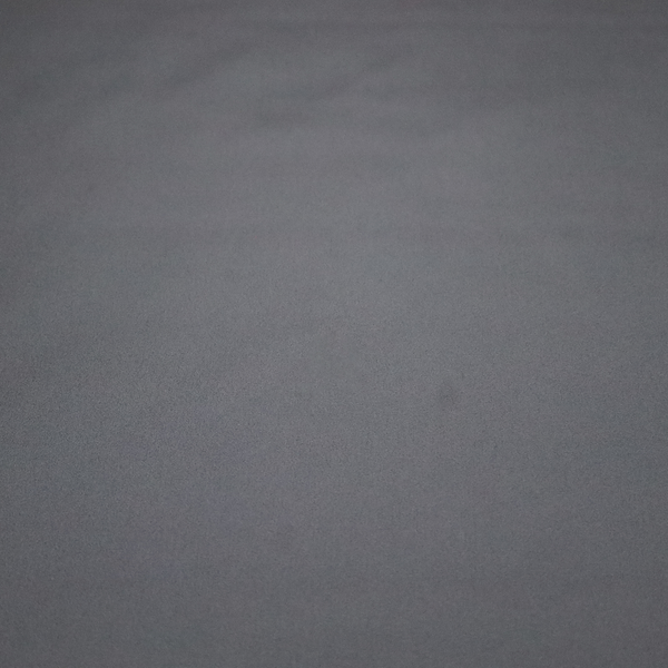 Plain, solid charcoal grey-coloured Hallstatt faux leather fabric texture with a smooth, fine finish.