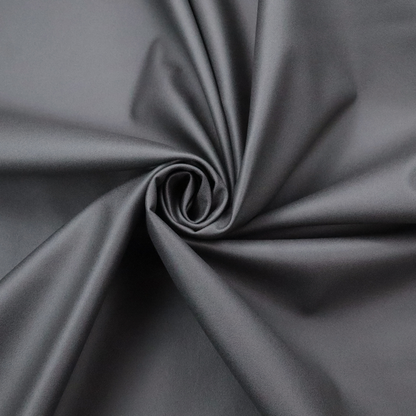 Plain, solid charcoal grey-coloured Hallstatt faux leather fabric texture with a smooth, fine finish.