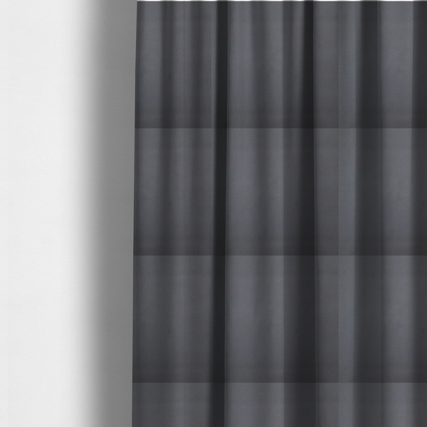 The fabric used to create these made-to-measure curtains is a plain, solid charcoal grey-coloured Hallstatt faux leather fabric texture with a smooth, fine finish.