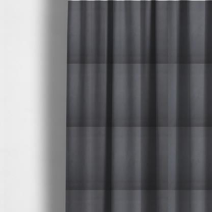 The fabric used to create these made-to-measure curtains is a plain, solid charcoal grey-coloured Hallstatt faux leather fabric texture with a smooth, fine finish.