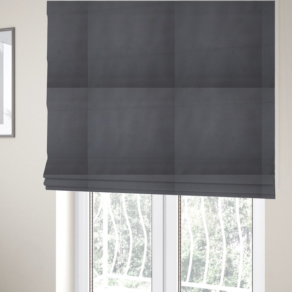 The fabric used to create these Roman blinds is a plain, solid charcoal grey-coloured Hallstatt faux leather fabric texture with a smooth, fine finish.