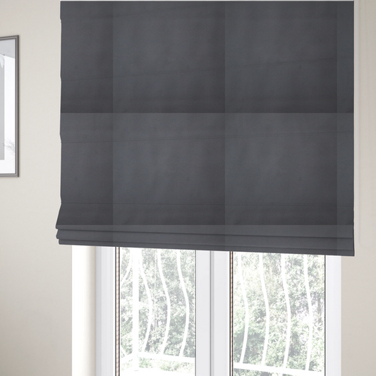 The fabric used to create these Roman blinds is a plain, solid charcoal grey-coloured Hallstatt faux leather fabric texture with a smooth, fine finish.