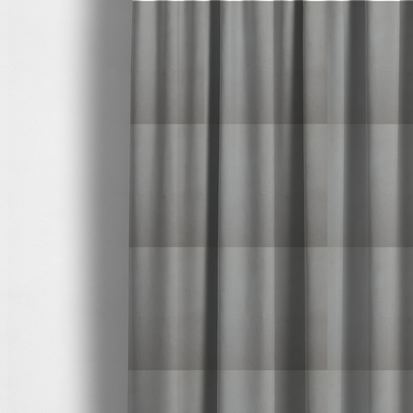 The fabric used to create these made-to-measure curtains is a plain, solid warm grey-coloured Hallstatt faux leather fabric texture with a smooth, fine finish.