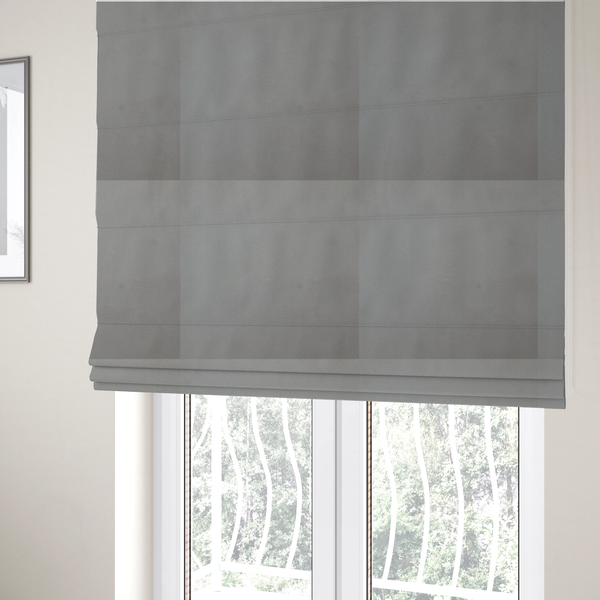 The fabric used to create these Roman blinds is a plain, solid warm grey-coloured Hallstatt faux leather fabric texture with a smooth, fine finish.