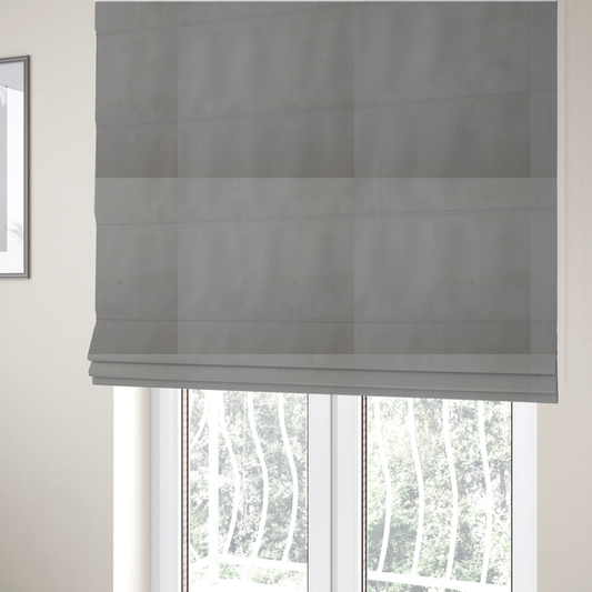 The fabric used to create these Roman blinds is a plain, solid warm grey-coloured Hallstatt faux leather fabric texture with a smooth, fine finish.
