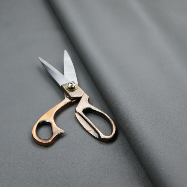 Plain, solid medium grey-coloured Hallstatt faux leather fabric texture with a smooth, fine finish.