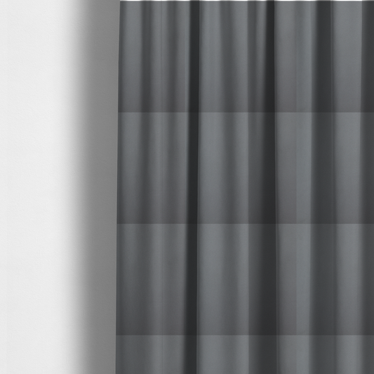 The fabric used to create these made-to-measure curtains is a plain, solid medium grey-coloured Hallstatt faux leather fabric texture with a smooth, fine finish.