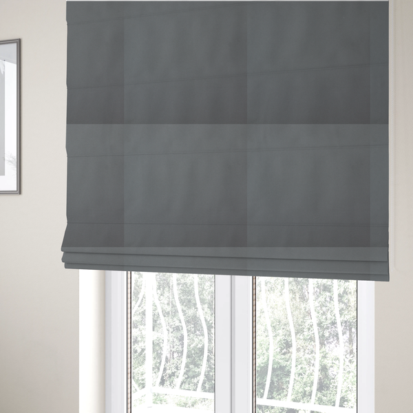 The fabric used to create these Roman blinds is a plain, solid medium grey-coloured Hallstatt faux leather fabric texture with a smooth, fine finish.