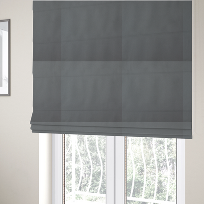 The fabric used to create these Roman blinds is a plain, solid medium grey-coloured Hallstatt faux leather fabric texture with a smooth, fine finish.