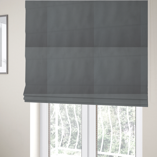 The fabric used to create these Roman blinds is a plain, solid medium grey-coloured Hallstatt faux leather fabric texture with a smooth, fine finish.