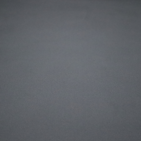 Plain, solid dark charcoal grey-coloured Hallstatt faux leather fabric texture with a smooth, fine finish.
